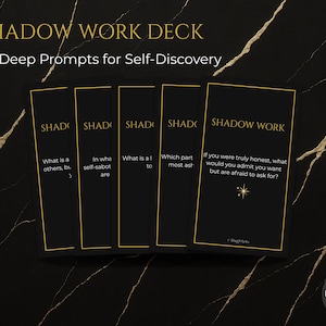 May include: A set of three ceramic mugs with a speckled, cream-colored glaze. Each mug features a different hand-painted floral design in shades of blue, green, and yellow. The mugs have a simple, rounded shape and a comfortable handle.