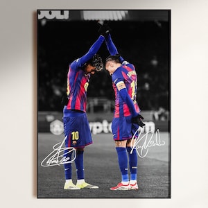 May include: Black and white photograph of two soccer players in blue and red uniforms, arms raised in a celebratory gesture. The players are on a field, with the number 10 visible on one player's shorts. Autographs are at the bottom.
