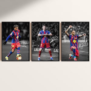 May include: Three framed prints featuring soccer players in action. Each player is wearing a blue and red uniform. The prints are in black and white, with the players in color. Each print has a signature.