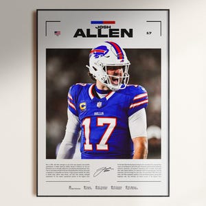 Pode incluir: Pôster emoldurado com Josh Allen, jogador de futebol americano, em uniforme azul e branco com o número 17. O pôster inclui o nome do jogador, o logotipo da equipe e uma assinatura. O fundo é uma imagem borrada de um jogo de futebol.