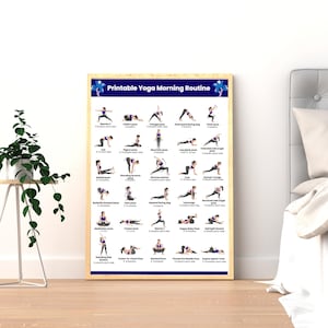 A framed "Printable Yoga Morning Routine" poster displayed as wall art on the floor next to a bed and a green potted plant, showing a clean aesthetic bedroom setup.
