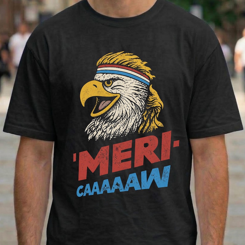 Distressed retro graphic featuring a bald eagle with a squawking open yellow beak and a blonde mullet haircut. The eagle wears a red, white, and blue striped athletic sweatband. Below the illustration, large weathered block text reads "'MERI-" in red, stacked above "CAAAAAW" in bright blue.