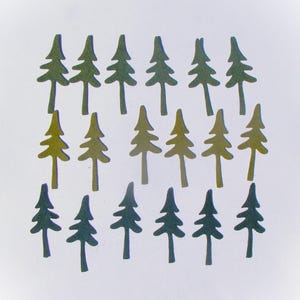 May include: A collection of small, stylized evergreen tree cutouts in varying shades of green and yellow-green. The trees are arranged in a grid pattern against a white background, suggesting a forest or woodland theme.