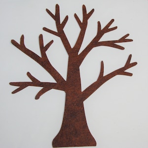 May include: A brown felt tree cutout with a trunk and multiple branches. The tree is a solid color and is set against a white background. The tree is a simple, stylized representation.