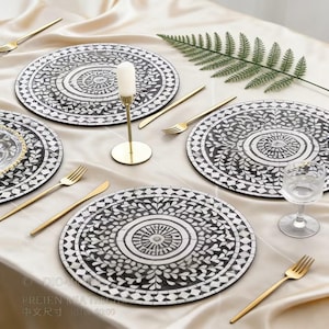 May include: A set of three ceramic mugs with a speckled, matte finish. The mugs are in shades of cream, light gray, and dark gray. Each mug has a simple, minimalist design and a rounded handle.