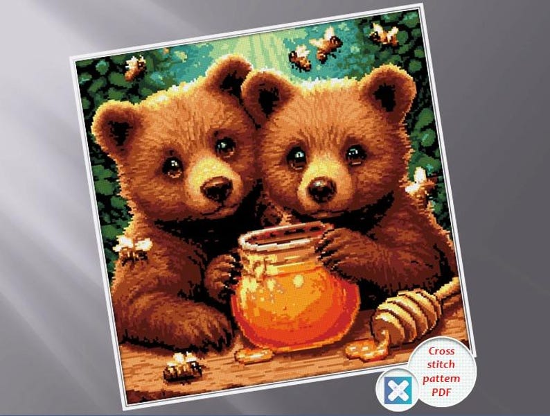 May include: A cross-stitch pattern featuring two brown bear cubs with honey and bees. The bears are holding a jar of honey and a honey dipper. The background is green and brown.