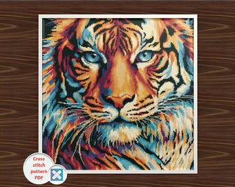 Patrón de punto de cruz de tigre en PDF: diseño de bordado de tigre de ojos azules a color.