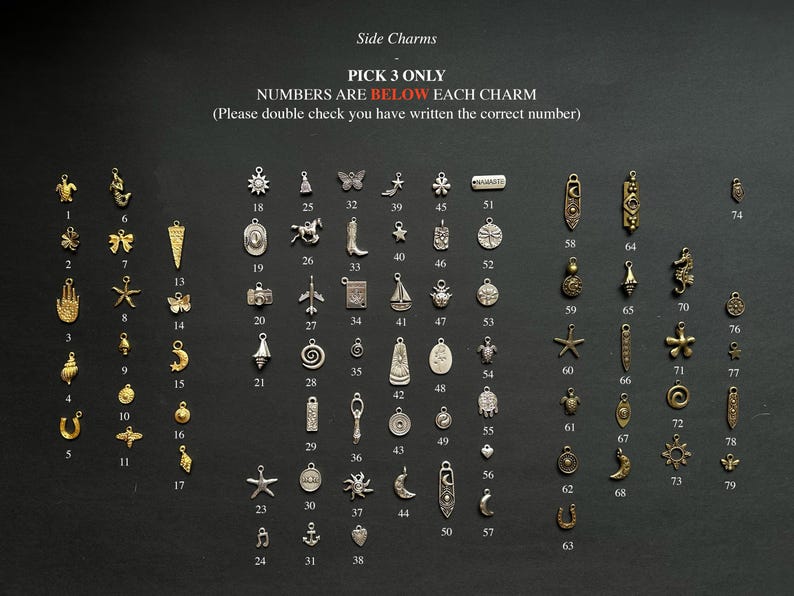 May include: A collection of small metal charms in gold and silver tones, arranged in columns with corresponding numbers from 1 to 79. The text reads: Side Charms, PICK 3 ONLY, NUMBERS ARE BELOW EACH CHARM, (Please double check you have written the correct number).