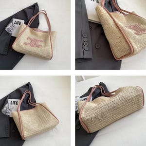 May include: A woven straw tote bag with pink trim and handles. The bag features a pink logo on the front. The bag is shown with a dark gray blazer and a clear glass with the word "LIFE" printed on it.
