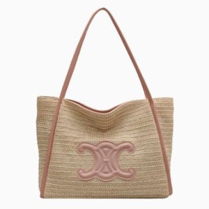 May include: A beige woven tote bag with a pink leather trim and handles. The bag features a large pink emblem on the front. The tote bag is designed with a rectangular shape and a spacious interior, perfect for carrying essentials.