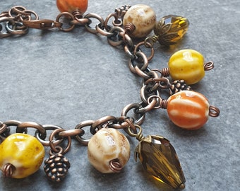 Höstberlockarmband: Boho-smycken med koppar, glas och ekollonpärlor
