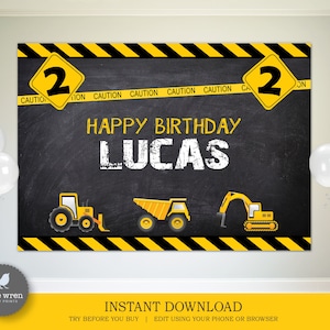 May include: A black chalkboard backdrop with yellow and black caution tape border. The text "HAPPY BIRTHDAY LUCAS" is written in white chalk. There are three yellow construction vehicles on the chalkboard. The numbers "2" are on yellow diamond signs with black borders.