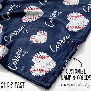 May include: Navy blue blanket with a baseball heart pattern. The blanket features distressed white baseball heart shapes with red stitching, and the name "Correa" and the number "4" in white. The blanket is customizable.