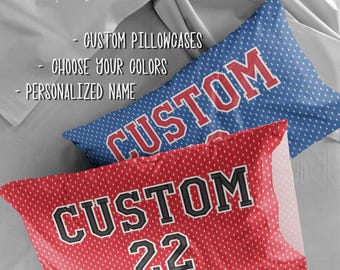 May include: Two custom pillowcases, one red and one blue, with white dot patterns. The red pillowcase has "CUSTOM 22" in black and white lettering. The blue pillowcase has "CUSTOM" in red and white lettering. The text "FOR YOU love always" is in the top left.