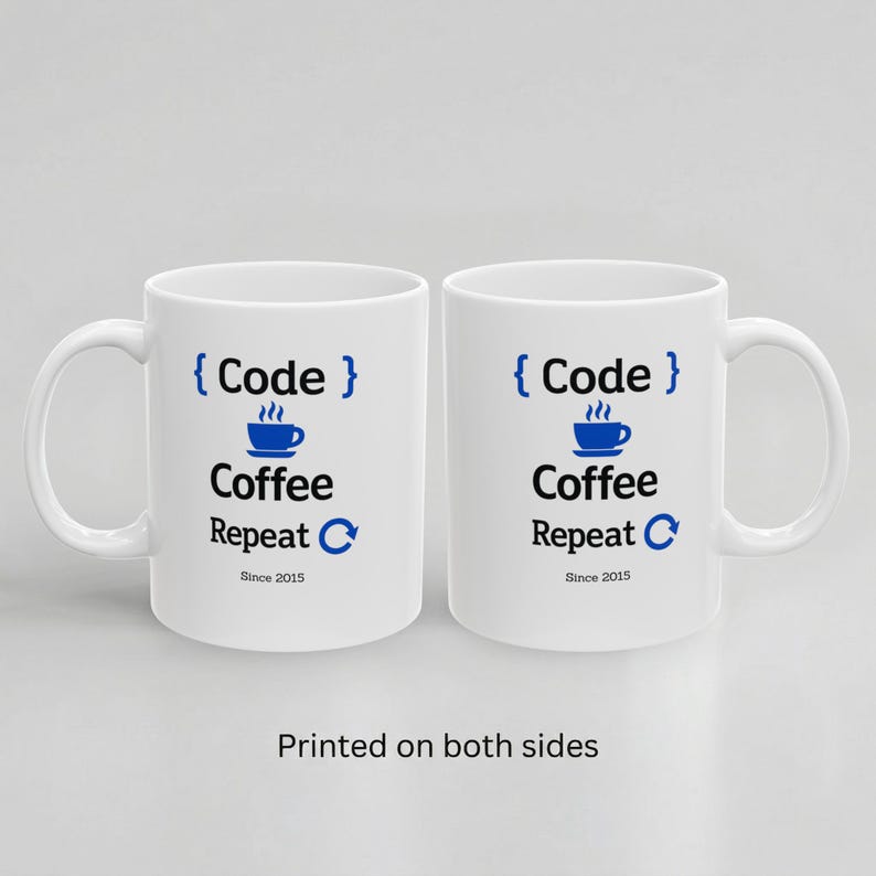 Two white ceramic mugs displayed side by side with handles on opposite sides, both showing the same “Code Coffee Repeat” design and “Since 2015” personalization to demonstrate double-sided printing.