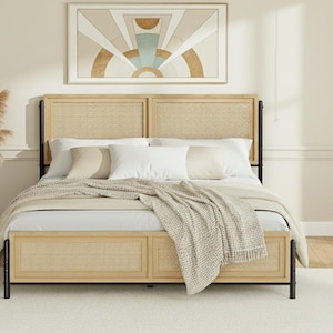 May include: A light wood bed frame with a woven headboard and footboard. The bed is made up with white bedding and a beige throw blanket. A framed art piece hangs above the bed. A white rug is on the floor.