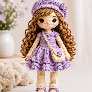 May include: A handcrafted crochet doll with long wavy brown hair, wearing a lavender beret with a small flower, a matching lavender ruffled dress with tiny floral accents, cream-colored shoes with lavender straps, and a small cream crossbody bag.