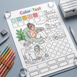 May include: A "Color Test" coloring page with a gaming theme. The illustration features a person relaxing with a handheld game console, a person gaming on a computer, and two cats. Colored pencils, markers, and a pencil sharpener are visible.