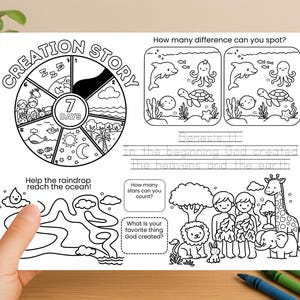 May include: Black and white activity sheet featuring the text "Creation Story" and "7 Days". Includes a maze, a spot-the-difference game, and illustrations of animals and people. The sheet is held by a hand.