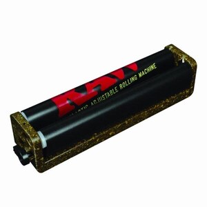 May include: A RAW adjustable rolling machine featuring a textured, speckled brown frame and two black rollers. The top roller displays the red RAW logo and the text "ADJUSTABLE ROLLING MACHINE" in yellow lettering against a black background.