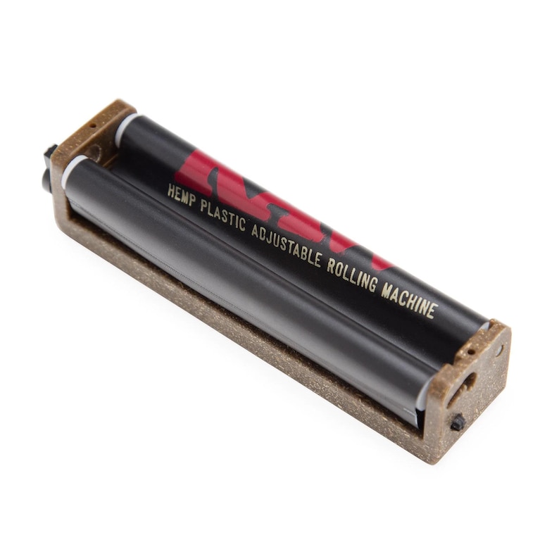 May include: A brown hemp plastic adjustable rolling machine with a black roller belt. The belt features red branding and the text HEMP PLASTIC ADJUSTABLE ROLLING MACHINE printed in gold lettering across the center of the device.