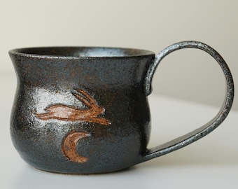 handmade ceramic bunny jumping over the moon sparkly space mug