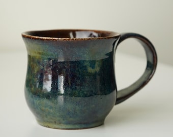 handmade ceramic whimsical blue green space galaxy fairy mug