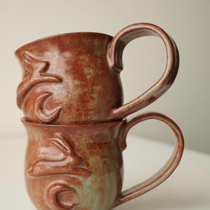 handmade ceramic bunny jumping over the moon woody space mug image 2