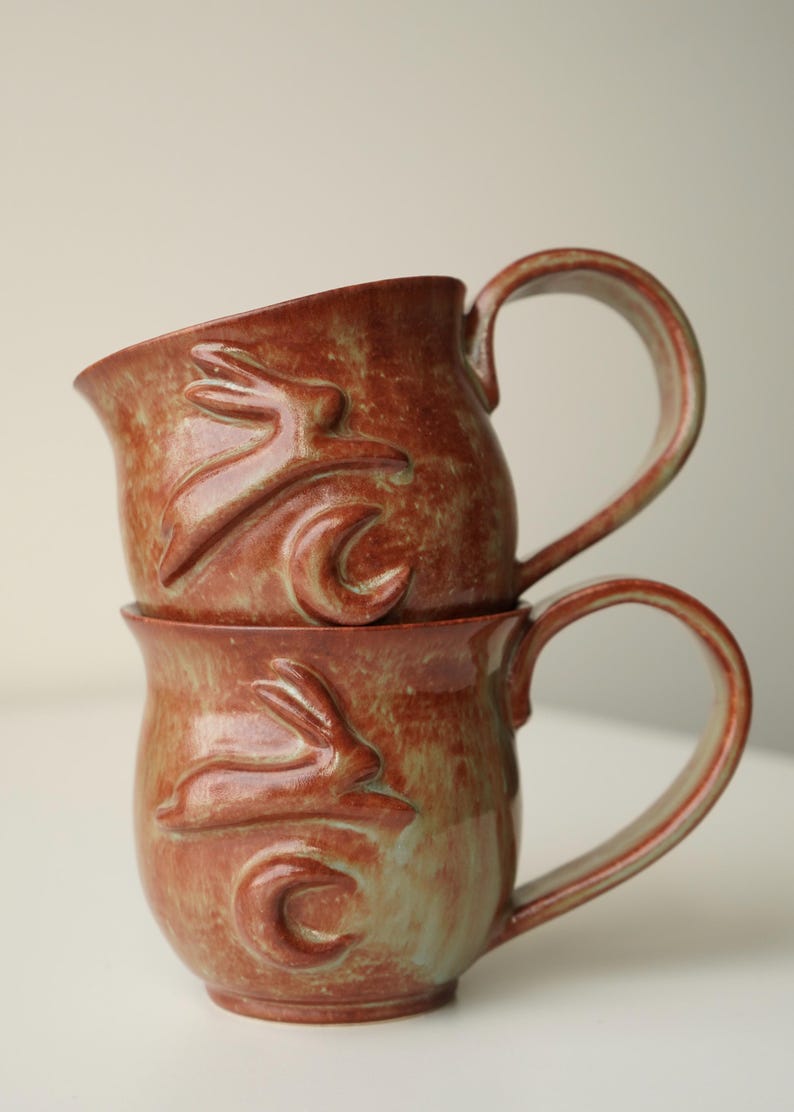 handmade ceramic bunny jumping over the moon woody space mug no preference