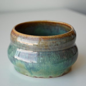 handmade ceramic green, blue, and brown galaxy bubble planter