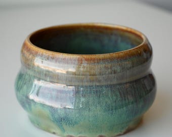 handmade ceramic green, blue, and brown galaxy bubble planter