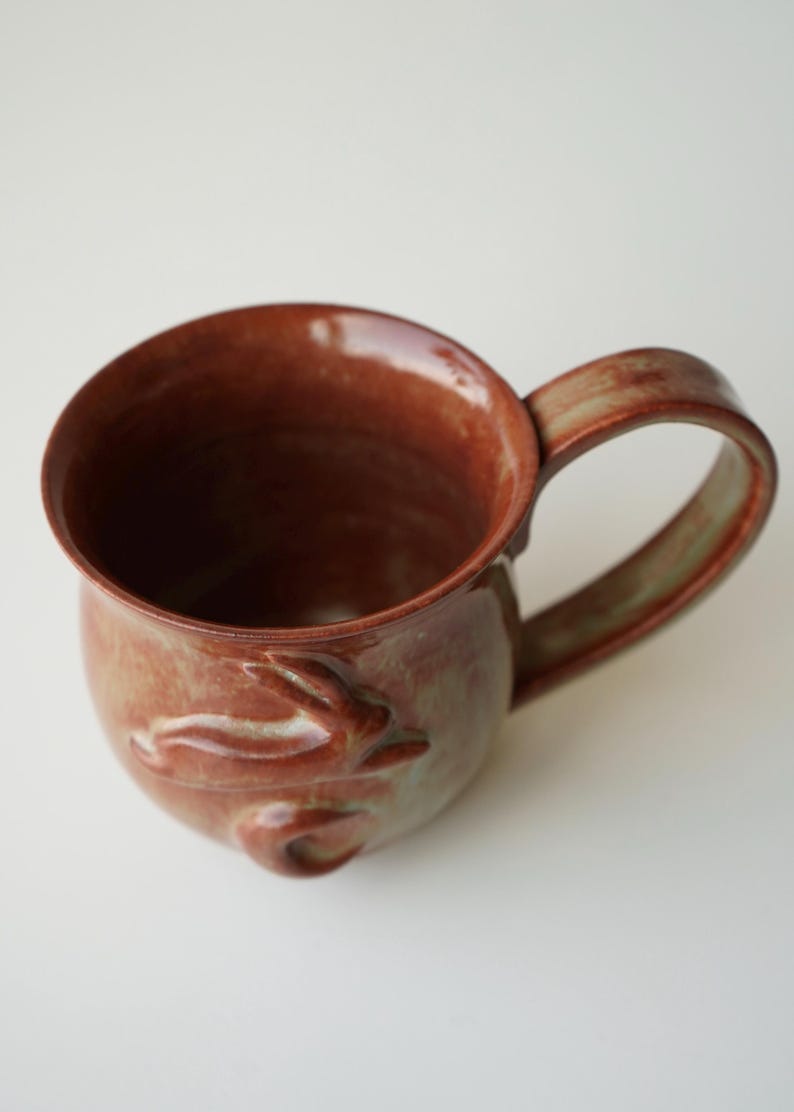 handmade ceramic bunny jumping over the moon woody space mug image 5