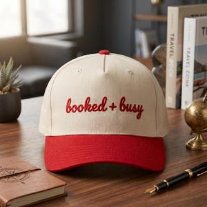 Booked and Busy Hat: Retro Script Trucker Cap Red Embroidered Hat