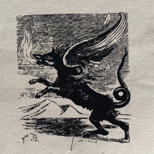 May include: A square piece of beige fabric featuring a black ink illustration of a winged, fire-breathing creature with a long, curled tail. The creature is depicted in a dynamic pose against a landscape background with the initials L.B. and J.A. printed.