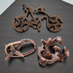 Metallmekaniska pussel – Cykel, Tjurhuvud, Ormpussel (Set om 3)
