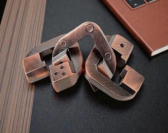 Rompecabezas metálico de tres hermanos con anillos entrelazados de aleación de zinc.