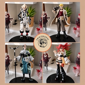 May include: A collection of four anime-style character figurines displayed on black circular bases. The figures feature diverse outfits, including tactical gear, long coats, and flowing garments, with one character holding a staff. A circular logo reads FRIK1SHOPSC.