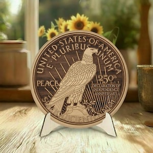 May include: A wooden plaque featuring a detailed relief of an eagle, with the text "UNITED STATES OF AMERICA" and "250th DECLARATION OF INDEPENDENCE ANNIVERSARY". The plaque is displayed on a wooden stand.