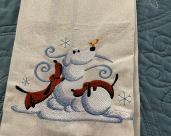 New kitchen tea towel with dachshund doxie Building a snowman