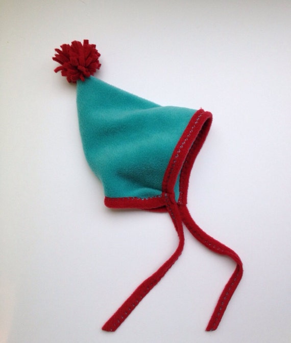 Items similar to Fleece Pom Pom Hat on Etsy