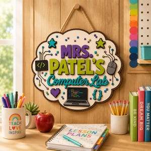 May include: A cloud-shaped wooden wall sign with a rope hanger featuring the text "MRS. PATEL'S Computer Lab" in purple, lime green, and teal. The sign includes colorful pixelated icons of a computer, mouse, heart, stars, and code brackets.