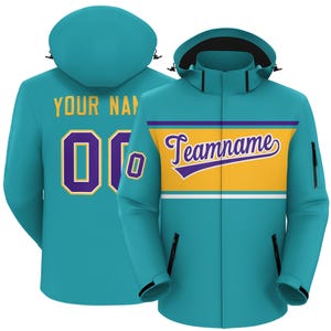 May include: A teal hooded jacket with a front zipper and two side pockets. The front features a yellow and purple stripe with the word "Teamname". The back displays the text "YOUR NAME" above the number "00" in purple with a gold outline.