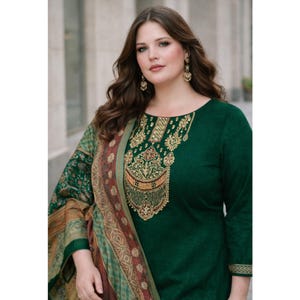 May include: A dark green, long-sleeved dress with gold embroidery around the neckline. A patterned shawl in shades of green, brown, and red is draped over the shoulders. The dress has a classic, elegant design.