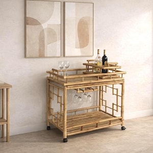 May include: A two-tiered bamboo bar cart on wheels featuring a slatted design, a built-in rack for hanging stemware, and a removable top tray. The cart holds two wine bottles and two clear glass wine glasses on its upper surface.