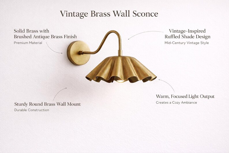 Pair of vintage brass wall sconces with downward, ruffled shades and curved arms, antique brass finish.