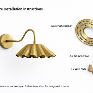 Pair of vintage brass wall sconces with downward, ruffled shades and curved arms, antique brass finish.