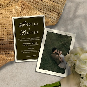 May include: Two wedding invitations with a dark olive green and white design. One invitation features the names "Angela + Deiter" and event details. The other shows a photo of a couple and the date. A bouquet of white flowers is in the foreground.