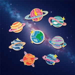 May include: A set of enamel pins depicting planets, including Mercury, Saturn, Jupiter, Earth, Neptune, Venus, Mars, and Uranus. Each pin features a different colour scheme and name. The pins have gold borders and are set against a dark blue space-themed background.