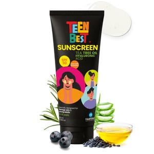 May include: Black tube of Teen Best Sunscreen with SPF 50, Tea Tree Oil, and Hyaluronic Acid. The tube features colorful text and illustrations of young people. Additional elements include aloe vera, blueberries, and a small bowl of oil.