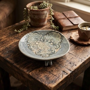 Studio Pottery Light Slate Blue Bowl with Imprinted Heart Doilie.
